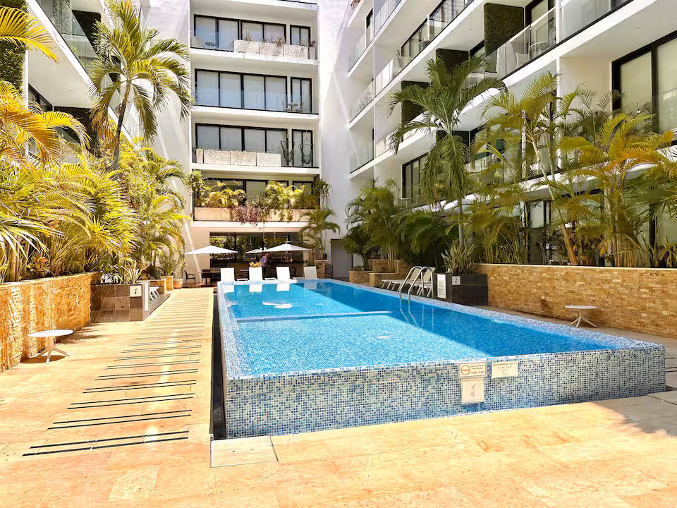 Playa del Carmen condo with cinema and pools